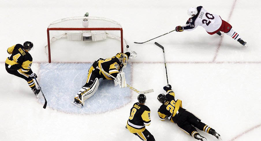 Brandon Saad of the Columbus Blue Jackets shoots wide of Pittsburgh Penguins goalie Marc-Andre Fleury.