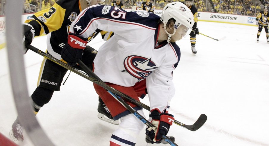 William Karlsson shields the puck away from Olli Maata during Game 1 of the series