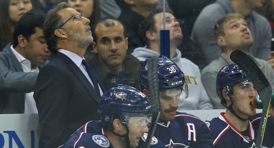 John Tortorella looks up at the scoreboard during a home game.