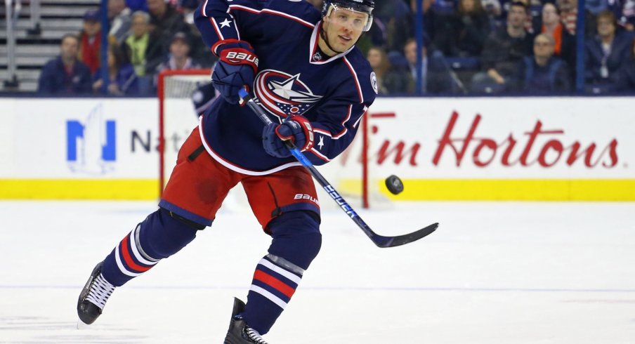 Jack Johnson passing the puck to his teammates up ice