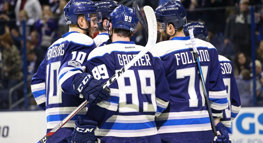 The Blue Jackets celebrate a goal while wearing their third jersey's.