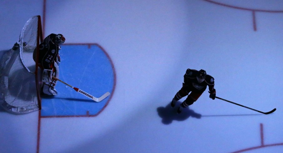 Cam Atkinson and Sergei Bobrovsky get ready to play during pregame warmups.