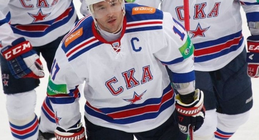 Ilya Kovalchuk celebrates with his teammates after scoring a goal