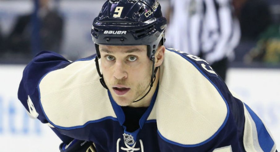 Gregory Campbell waits for the puck to be dropped during a game