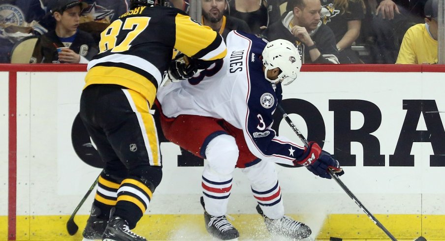 Seth Jones fends off Sidney Crosby