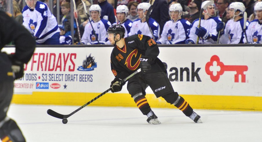 Oliver Bjorkstrand skates the puck up against the Toronto Marlies