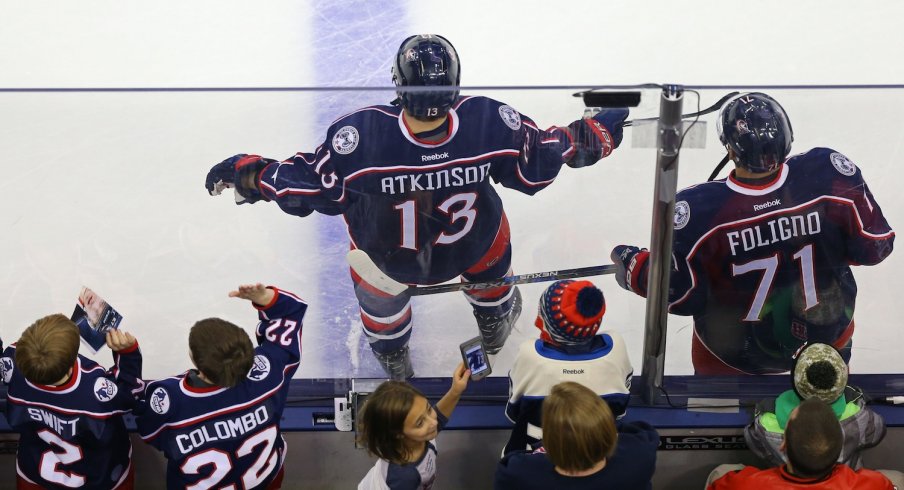 Nick Foligno and Cam Atkinson get ready during warm up