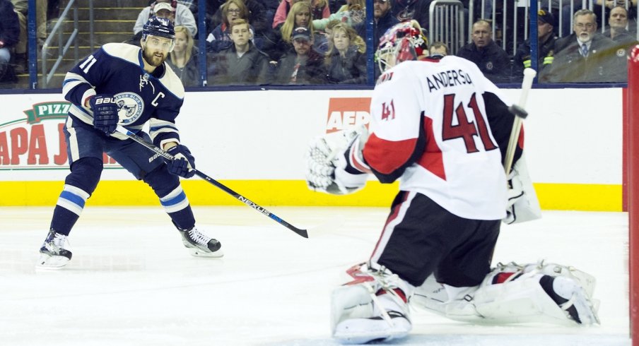 Nick Foligno takes a shot on Senators goalie Craig Anderson