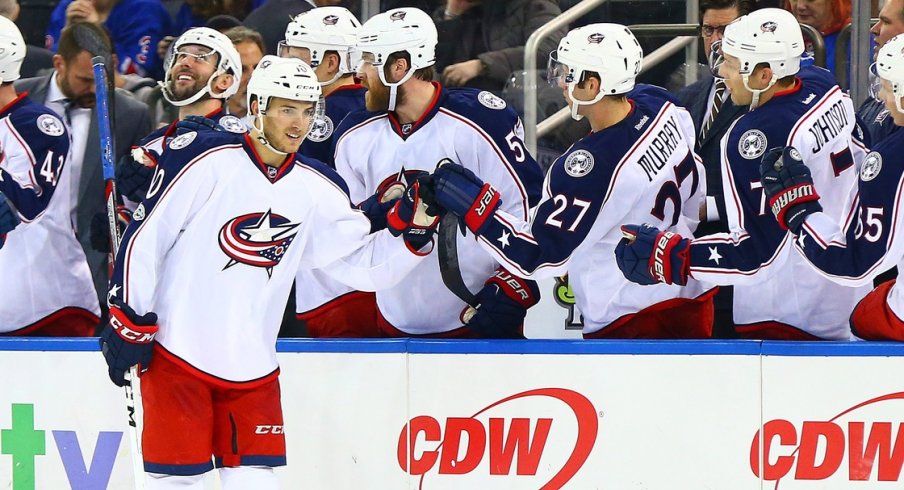 Alex Wennberg swings by the benches to celebrate after a goal.