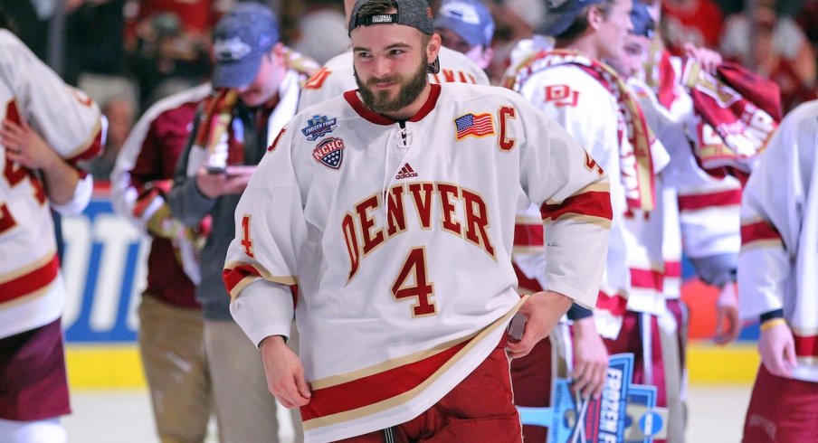 Will Butcher celebrates after the University of Denver won the NCAA National Championship