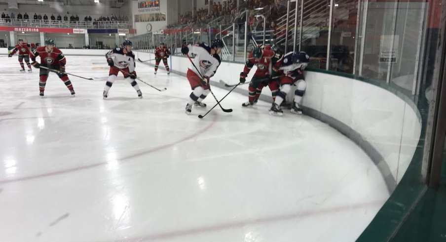 The Columbus Blue Jackets wait for the puck to drop during their second game in Traverse City against the Minnesota Wild