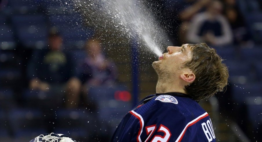 Sergei Bobrovsky takes a moment in between play to stay hydrated