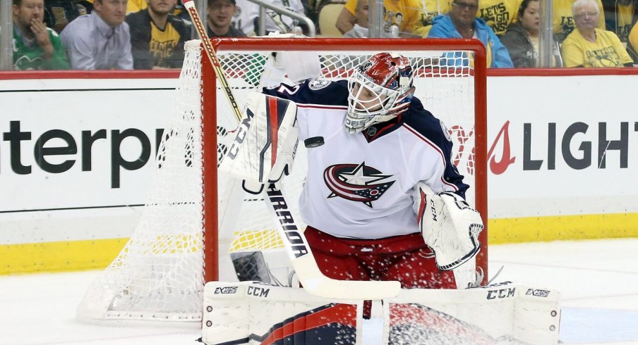 Sergei Bobrovsky stops a puck during the Stanley Cup playoffs
