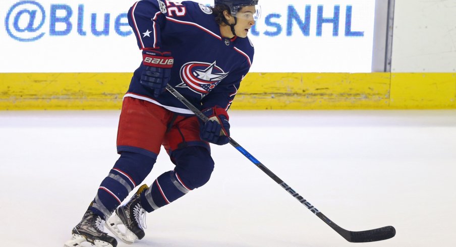 Sonny Milano skates up the ice with the puck during the preseason