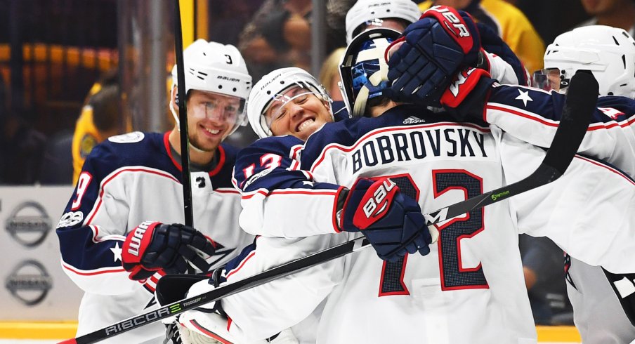 Cam Atkinson hugs Sergei Bobrovsky