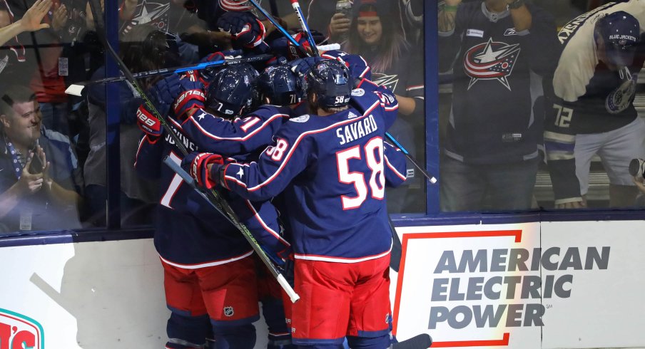 Sonny Milano celebrates his first goal with his teammates. 