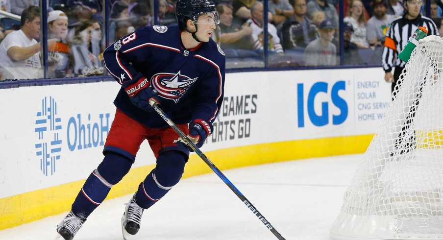 Zach Werenski carries the puck up the ice 