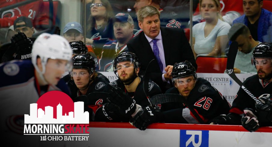 Bill Peters talks to the Carolina Hurricanes bench during play 