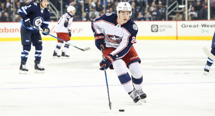 Zach Werenski carries the puck against the Winnipeg Jets during the fourth-straight win for the Columbus Blue Jackets