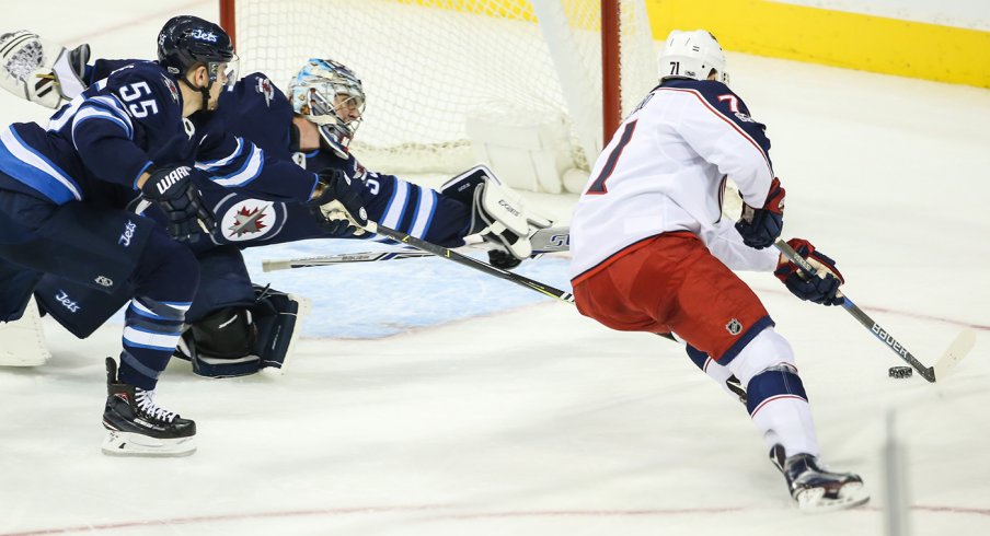 Nick Foligno moves in on Steve Mason before scoring a goal.