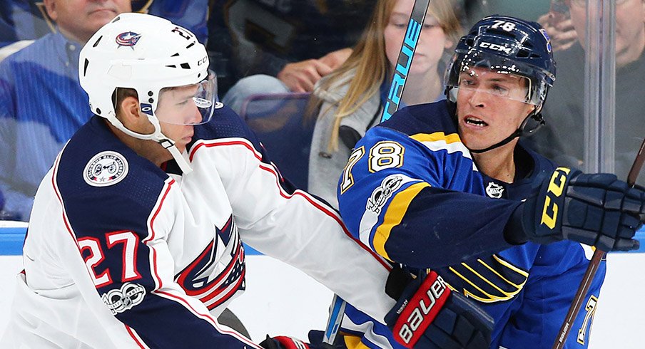 Ryan Murray battles a St. Louis Blues player in the Blue Jackets 4-1 loss. 