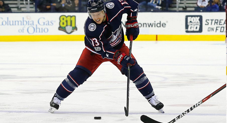 Cam Atkinson skates with the puck against the Nashville Predators.