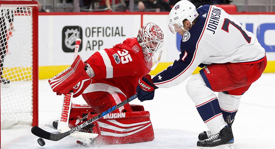 Jack Johnson slides a shootout winner past Detroit goalie Jimmy Howard on Saturday.