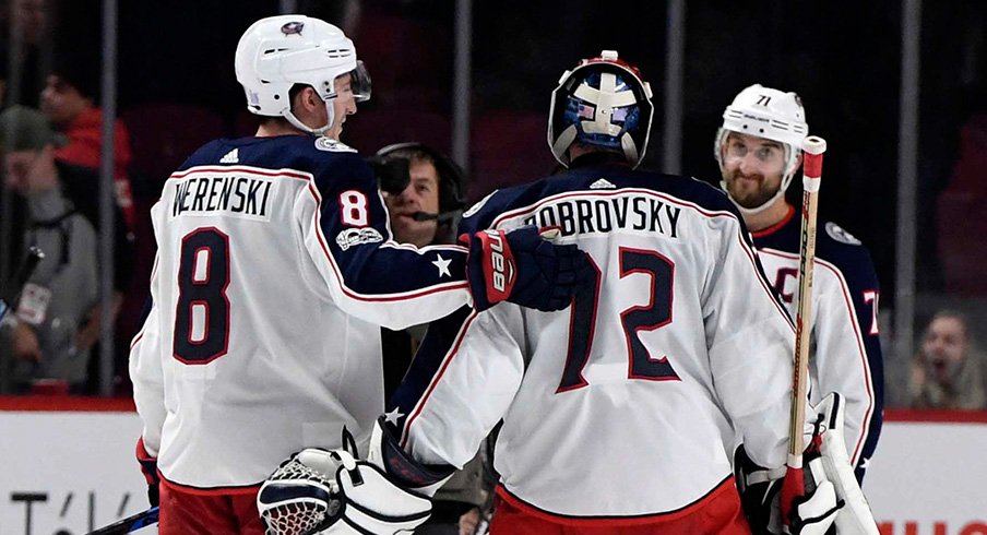 Nick Foligno goes in for the hug after a Blue Jackets win.