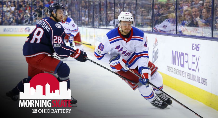 Michael Grabner tries to skate around Oliver Bjorkstrand at Nationwide Arena