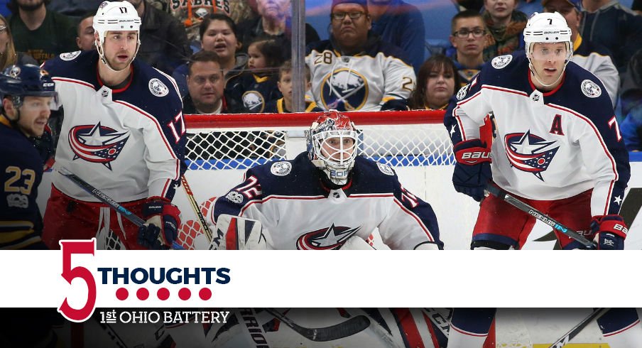 Brandon Dubinsky and Jack Johnson protect the net front for the Blue Jackets