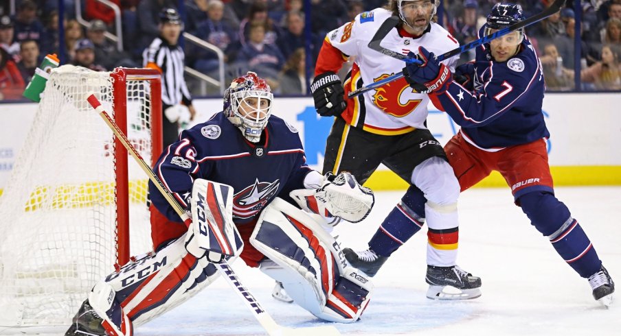 Sergei Bobrovsky awaits the puck as Jaromir Jagr sits near the front of the net