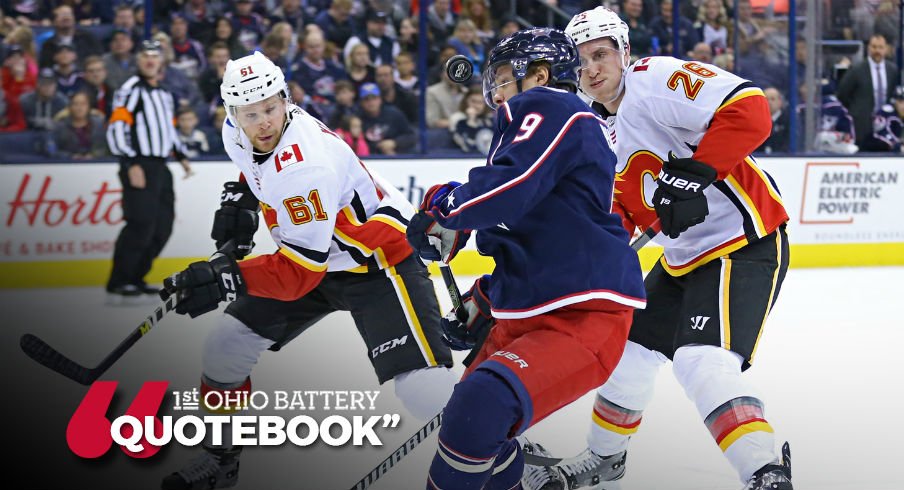 Artemi Panarin fights for the puck with Brett Kulak and Michael Stone chasing him