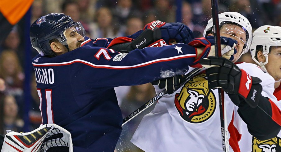 Nick Foligno and Dion Phaneuf shove each other during a stoppage in play during the Ottawa-Columbus game.