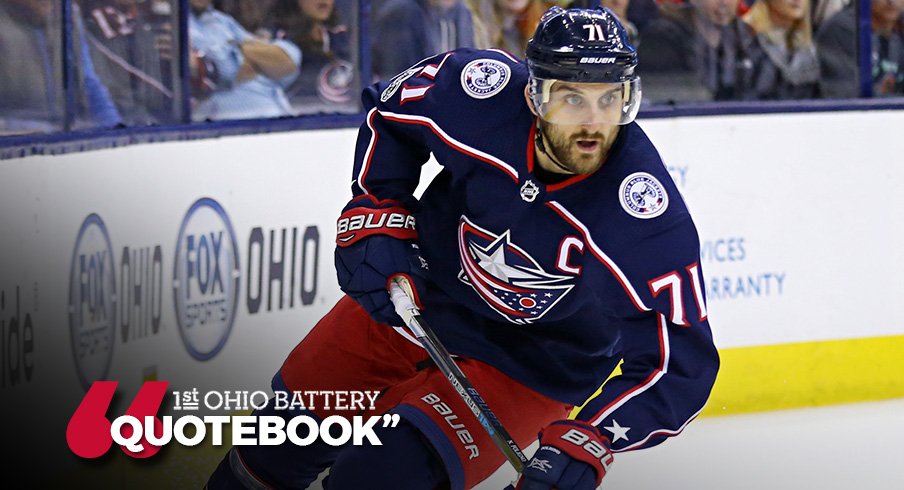 Nick Foligno eyes the puck while skating against the Ottawa Senators 