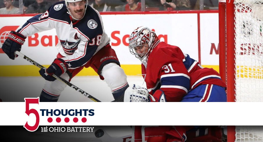 Boone Jenner tries to sneak a puck past goaltender Carey Price