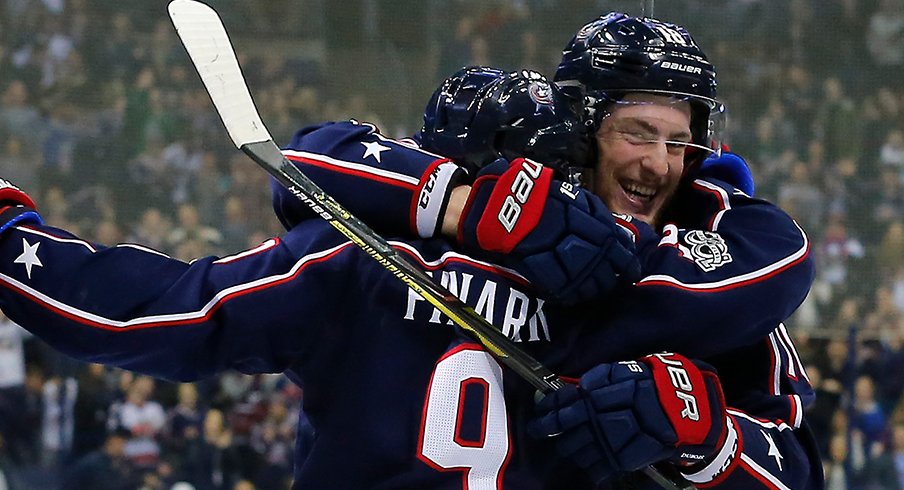 Pierre-Luc Dubois and Artemi Panarin celebrate a goal in the Blue Jackets' 4-2 win over the Ducks