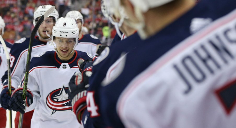 Artemi Panarin celebrates with teammates