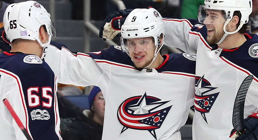 Josh Anderson and Markus Nutivaara congratulate Artemi Panarin.