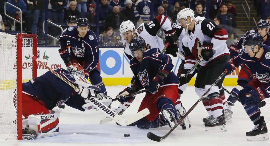Sergei Bobrovsky scrambles to cover up the puck against a feisty Arizona Coyotes team