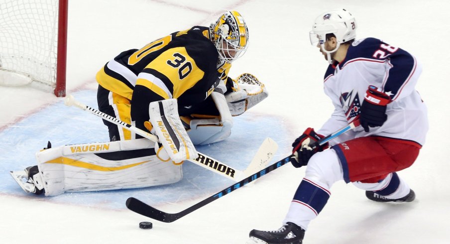 Oliver Bjorkstrand tries to slip the puck by Matt Murray during the shootout