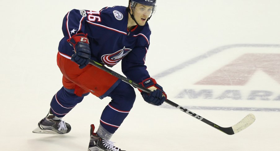 Dean Kukan skates up the ice waiting to receive the puck