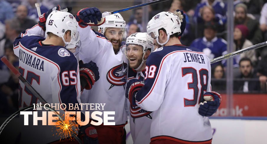 Blue Jackets celebrate a goal from Nick Foligno in the third period