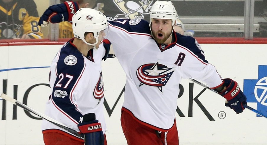 Brandon Dubinsky and Ryan Murray celebrate a goal scored against the Pittsburgh Penguins