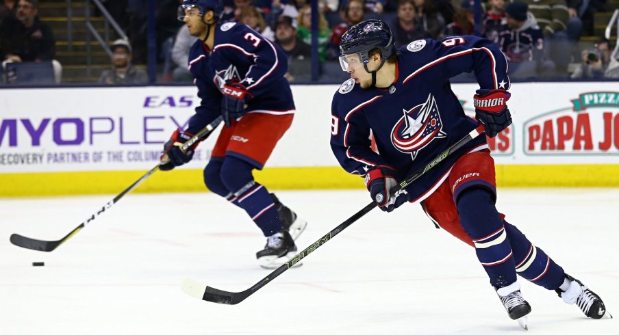 Blue Jackets Seth Jones and Artemi Panarin skate up the ice together with the puck