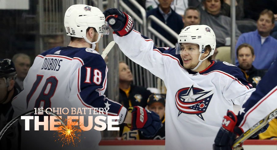 Artemi Panarin and Pierre-Luc Dubois celebrate a goal against the Penguins.