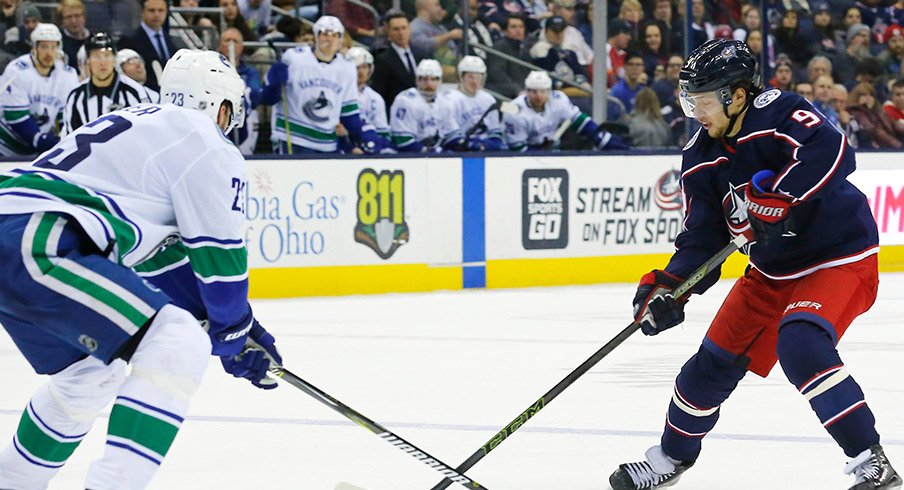 Artemi Panarin carries the puck against the Vancouver Canucks.