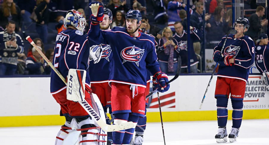Blue Jackets celebrate a win with goaltender Sergei Bobrovsky at Nationwide Arena
