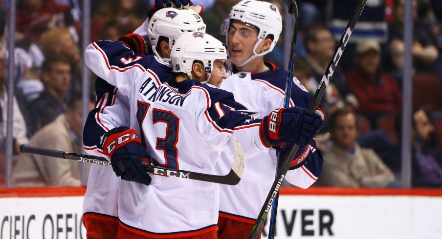 Cam Atkinson celebrates with teammates