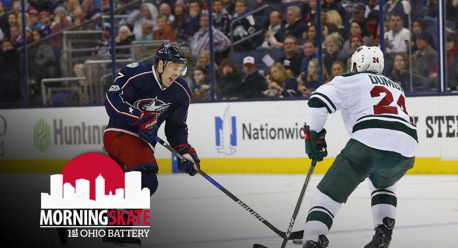 Jack Johnson tries to skate past Matt Dumba