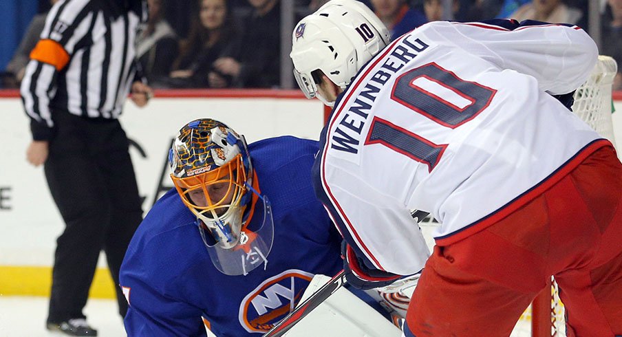 Jaroslav Halak stops an Alexander Wennberg shot 